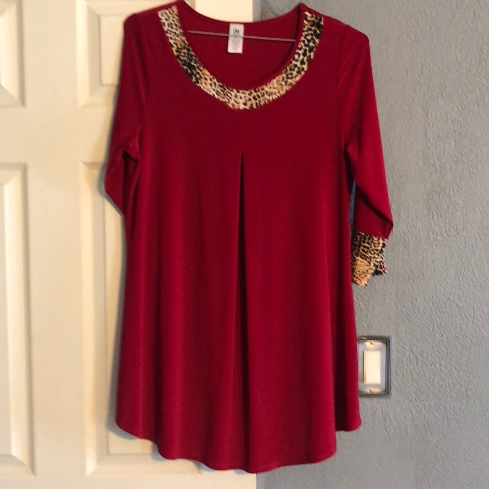 Never been worn. Red tunic.